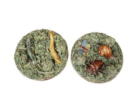 A pair of late 19th century Portuguese small circular Palissy style majolica plaques incorporating lizard and snail and with 