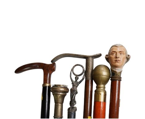 Six walking sticks, one with a plated snuff box handle, a stick with hidden glass flask, a stick with a handle in the form of
