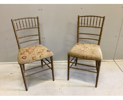 A pair of early 20th century gold painted faux bamboo tapestry seat ballroom chairs, height 83cm. Condition - poor