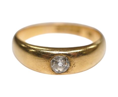 A late Victorian 18ct gold and single stone gypsy set diamond ring, size P, gross weight 5.3 grams. Condition - fair