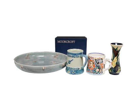Ceramics comprising a Moorcroft mug (restored), a Dame Laura Knight mug, both Royal commemorative, Moorcroft vase and Clarice