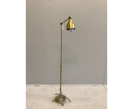 A Contemporary gilt metal adjustable floor lamp, height 143cm. Condition - good