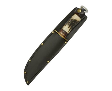 A small bowie knife by R. Cooper in its leather sheath, blade 15cm. Condition - good * Due to new safety regulations and lega
