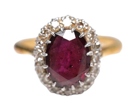 A 9ct and plat, garnet and diamond chip set oval cluster ring, size L, gross weight 3.9 grams. Condition - fair
