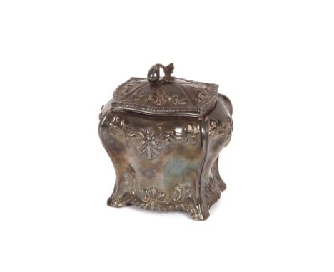 An 18th Century silver tea caddy, of bomb shape with shell and foliate decoration, the detachable lid with fruit and leaf fin