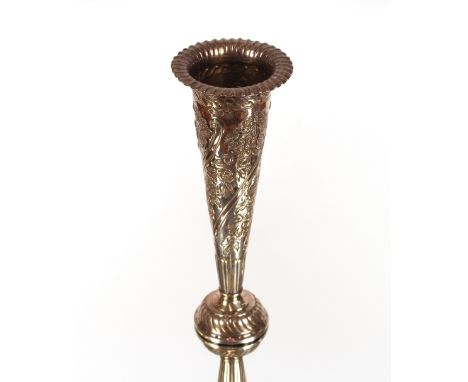 A late Victorian silver trumpet shaped spill vase, all over foliate decoration, weighted base, London 1892, 20cm high