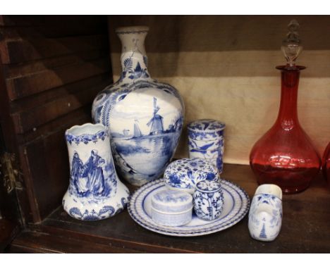 A Delftware blue and white baluster vase,&nbsp;decorated with windmills and canal; a Royal Bonn vase decorated with figures; 