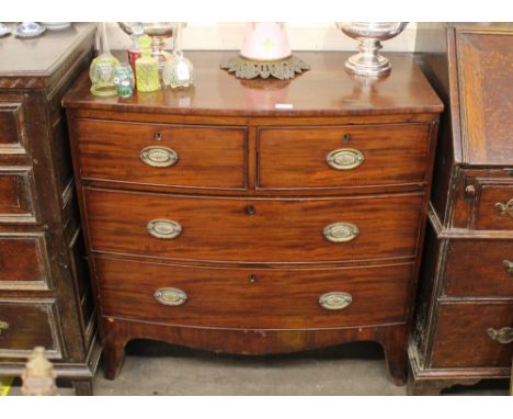 A Georgian mahogany bow front chest,&nbsp;of two short and two long drawers raised on shaped apron and bracket feet, 92cm wid