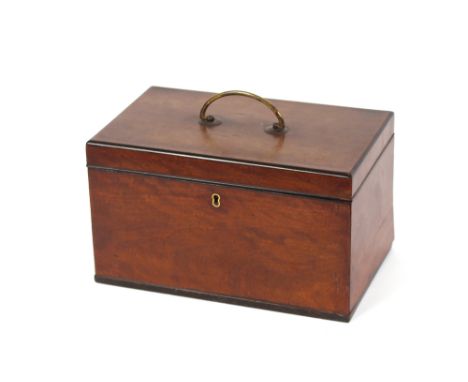 A Georgian mahogany three compartment tea caddy,&nbsp;the hinged lid fitted with a brass handle, 28cm wide&nbsp;