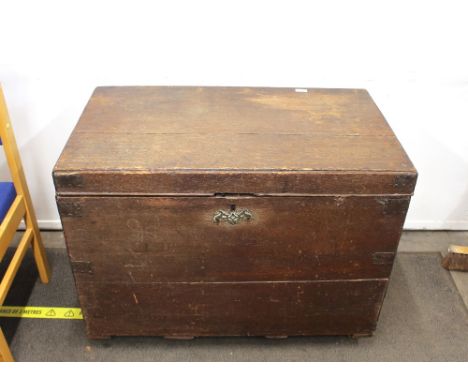 A large 19th Century oak trunk,&nbsp;flanked by brass carrying handles, 91cm wide&nbsp;