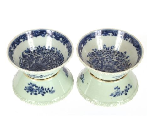 A pair of late 18th Century Chinese circular dishes,&nbsp;with ribbed borders and floral decoration on a light celadon ground