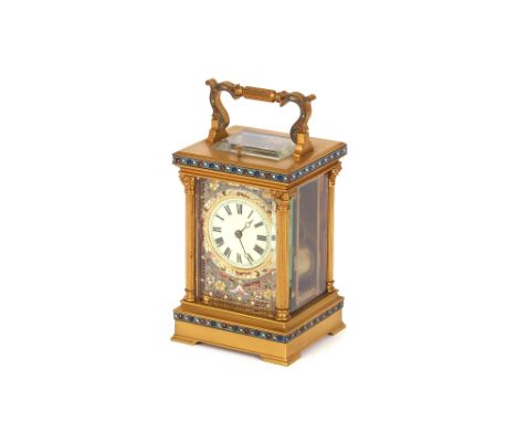A brass and champleve enamel striking carraige clock,&nbsp;with repeat movement 19cm high