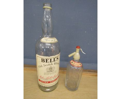 Large Bells Whisky bottle and vintage Rawlings soda water bottle with etched glass 