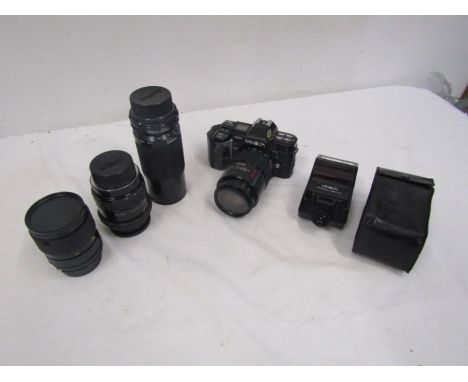 Minolta 7000 camera with 4 lenses, flash and bag 