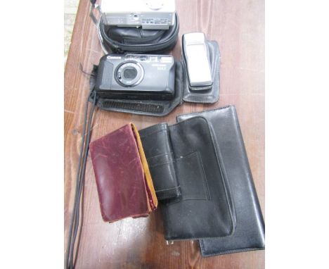 A Canon powershot camera, sure shot max and Nokia phone plus 4 leather wallets/purses