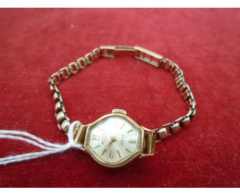 A Ladies rotary 27 jewels watch with 9ct gold link strap, gross 11.85g