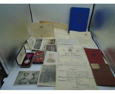 A collection of Ephemera including a boxed Imperial Service Medal relating to Anthony Griffiths Cains (Royal Navy) and Franci