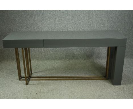 A contemporary designer lacquered and gilt metal console table by Meridiani. H.75 W.172 D.45cm. 