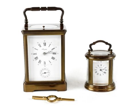 An Angelus French brass chiming carriage clock, the circular enamelled dial set with Arabic and Roman numerals and subsidiary