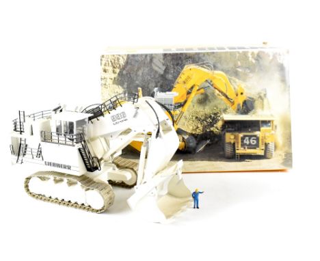 A Conrad No.2811 1/50th scale diecast model of a Liebherr R996 Hydraulic Excavator, finished in yellow, in the original polys