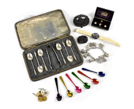 A hallmarked silver charm bracelet with ten silver charms and heart clasp, a cased set of plated Apostle spoons and tongs, a 