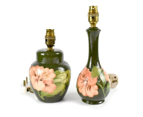 Two Moorcroft green ground 'Hibiscus' pattern table lamp bases, one of bulbous form with slender flared neck, height includin