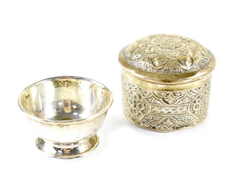 A Victorian hallmarked silver trinket pot and cover with repoussé decoration, Birmingham 1888, and a small silver bowl, Edwar