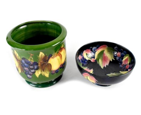 A Moorcroft limited edition green ground 'Fruit and Vine' pattern jardinière designed by Marjorie Kubanda, originally for the
