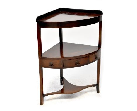 A 19th century mahogany corner washstand of two tiers with three trinket drawers above an undertier, on square outswept legs,