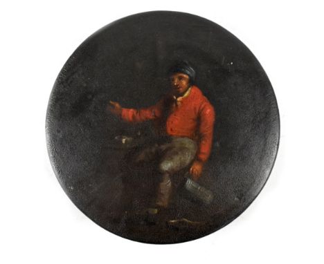 A 19th century Stobwasser-style black lacquered circular snuff box, the top decorated with a painted tavern scene depicting a