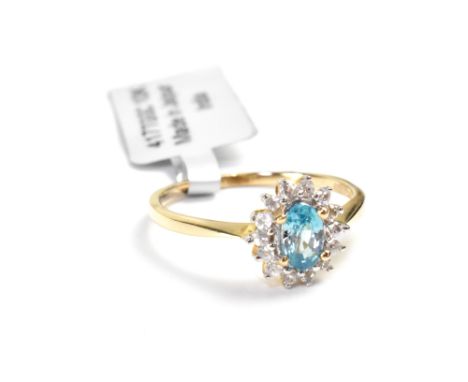 A 10ct yellow gold ladies' dress ring, floral-set with central topaz and diamond surround, size P, approx 2g. CONDITION REPOR