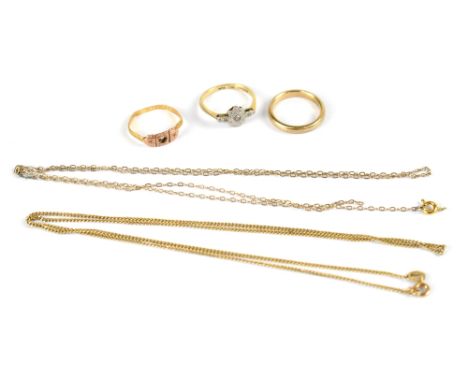 Three hallmarked 9ct gold rings to include a band, size L, an Edwardian ring with tiny diamond set in white metal square head
