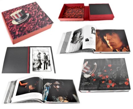 A limited edition no.696/2600 signed Ethan A Russell book, 'Let It Bleed, The Rolling Stones 1969 USA Tour', the book and fol