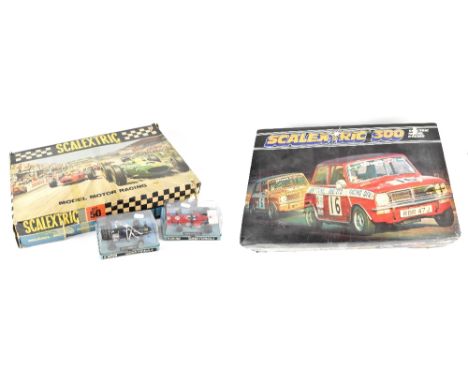 A boxed Scalextric 300 model racing set, a boxed Scalextric Set 50 model motor racing kit and two Scalextric cars, Marchford 