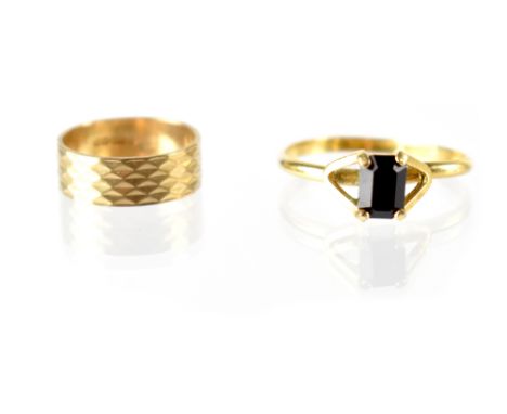 A 9ct gold wedding band, size I, approx 2g, and a yellow metal ladies' dress ring with emerald cut red stone (af) (2).