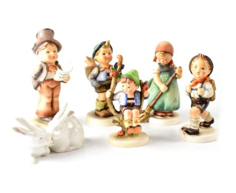 Five Goebel/Hummel figures to include Alpine walkers, boy in apple tree, carol singer, also Royal Copenhagen figure depicting