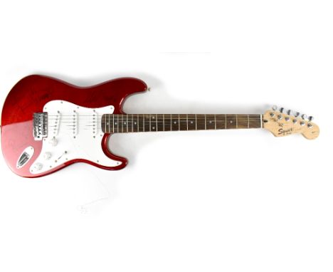 Rolling Stones; an autographed Fender Squire Stratocaster guitar autographed by all three Rolling Stones guitarists, Mick Tay