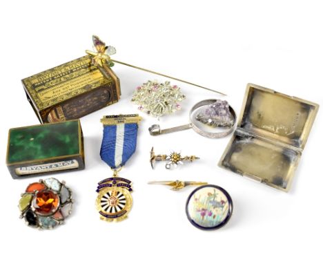 An Edwardian 9ct gold and seed pearl bar brooch, a hand painted pottery brooch, a small engine turned silver matchbook holder