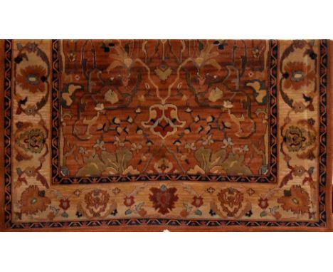 A modern brown ground rug with a central square of Chinoiserie flowers and fauna surrounded by a light brown border of repeat