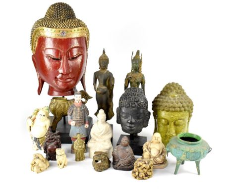 A group of Oriental figures in various media to include metal and ceramic, a Siamese bust on wooden stand, Bali gods and godd