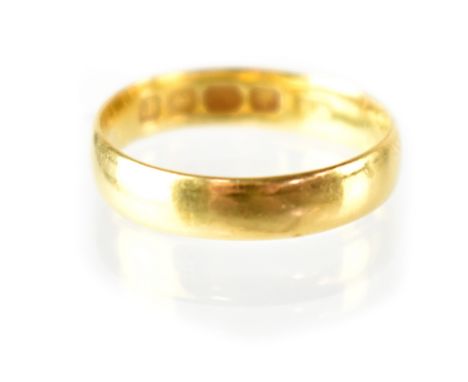 A 22ct yellow gold wedding band, size K, approx 2.9g.