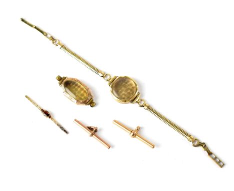 Various items of gold to include an 18ct T-bar, a 9ct T-bar, a 9ct strip with claw-set ruby (possibly from a brooch) and two 