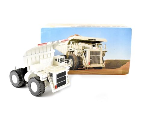 A Conrad 1/50th scale diecast model of a Liebherr KL 2450 The Mining Truck, finished in white, in the original polystyrene pa