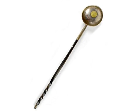 An early 19th century silver toddy ladle with twisted baleen handle, the bowl is inset with an 1820 Colombia Ferdinand Escudo