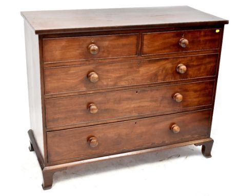 A Regency mahogany chest of two short over three long drawers, turned handles, on bracket feet. CONDITION REPORT There is som