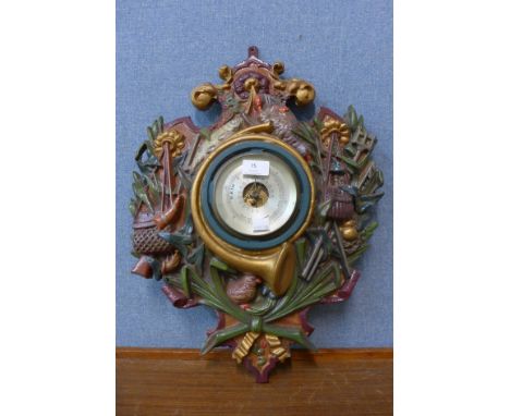 An early 20th Century painted cast iron wall hanging aneroid barometer 
