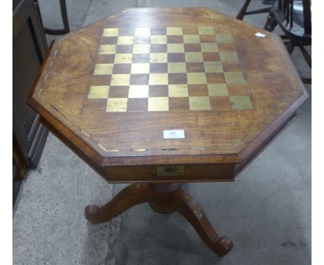 An eastern hardwood and brass inlaid octagonal tripod games table 