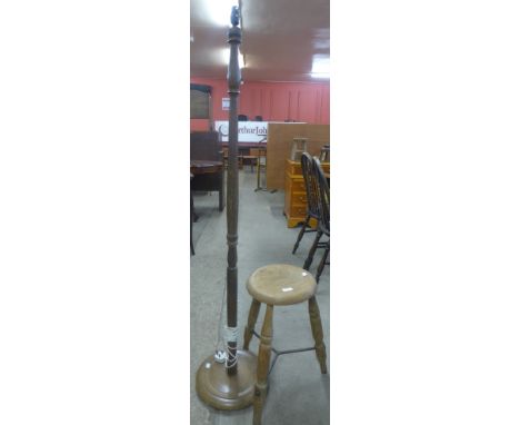 A Victorian oak and steel kitchen stool and a beech standard lamp 