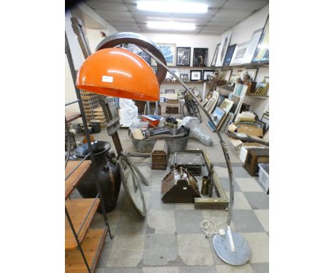 A vintage chrome and orange glass floor standing arc lamp 