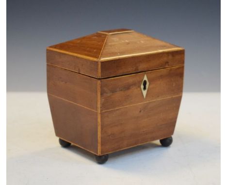 George III string inlaid mahogany sarcophagus shaped tea caddy, the hinged cover opening to reveal a white metal framed satin
